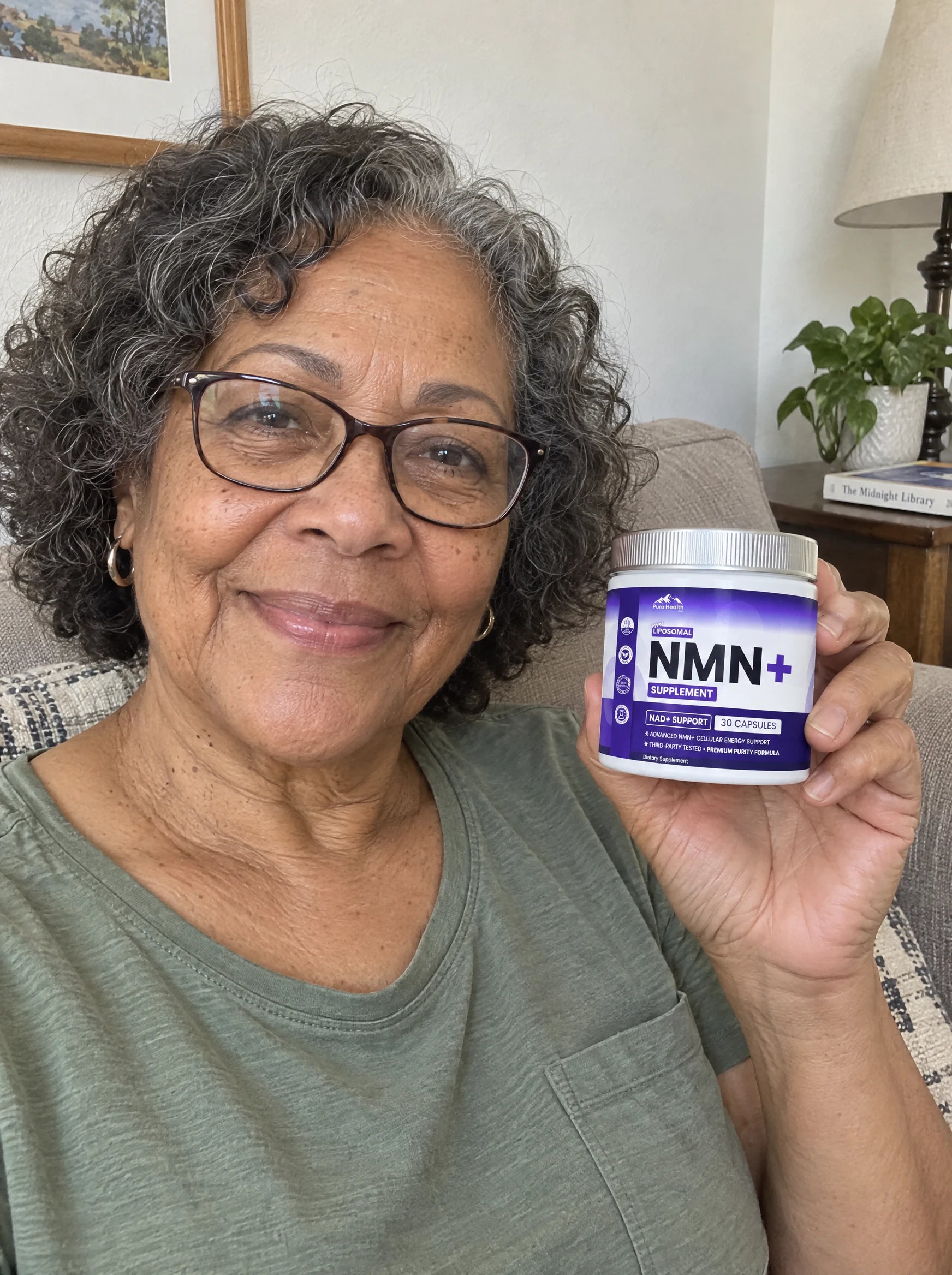 AI-generated casual phone photo of a woman in her sixties with reading glasses holding PHM NMN+ at home