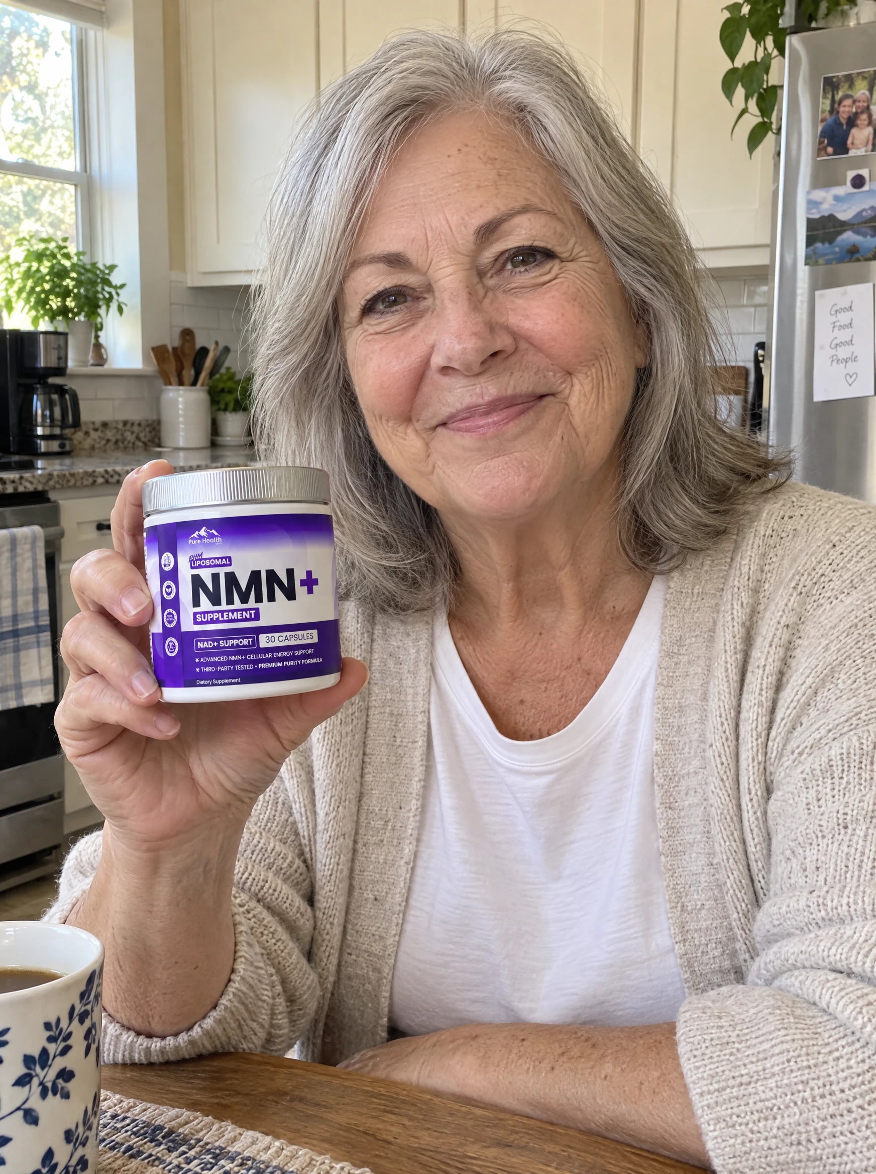 AI-generated casual phone photo of a woman in her late sixties holding a compact PHM NMN+ jar at her kitchen table